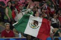 Fans of Mexico wait for the start of Uzbekistan's Asadkhuja Muydinkhujaev fight against Mexico's Marco Verde in their men's 71 kg final boxing match at the 2024 Summer Olympics, Friday, Aug. 9, 2024, in Paris, France. (AP Photo/Ariana Cubillos)