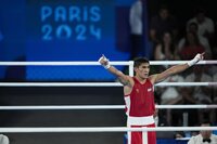 Uzbekistan's Asadkhuja Muydinkhujaev celebrates after defeating Mexico's Marco Verde in their men's 71 kg final boxing match at the 2024 Summer Olympics, Friday, Aug. 9, 2024, in Paris, France. (AP Photo/Ariana Cubillos)