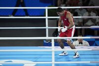 Uzbekistan's Asadkhuja Muydinkhujaev gestures after defeating Mexico's Marco Verde in their men's 71 kg final boxing match at the 2024 Summer Olympics, Friday, Aug. 9, 2024, in Paris, France. (AP Photo/Ariana Cubillos)