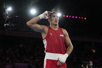 Uzbekistan's Asadkhuja Muydinkhujaev celebrates after defeating Mexico's Marco Verde in their men's 71 kg final boxing match at the 2024 Summer Olympics, Friday, Aug. 9, 2024, in Paris, France. (AP Photo/John Locher)