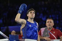 Uzbekistan's Asadkhuja Muydinkhujaev, right, fights Mexico's Marco Verde in their men's 71 kg final boxing match at the 2024 Summer Olympics, Friday, Aug. 9, 2024, in Paris, France. (AP Photo/Ariana Cubillos)