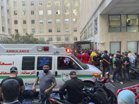 People queue to donate blood at the American University hospital after the arrival of several men who were wounded by exploded handheld pagers, in Beirut, Lebanon, Tuesday, Sept. 17, 2024. (AP Photo/Bassam Masri)