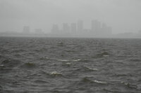 A boat damaged in Hurricane Helene rests against a bridge ahead of the arrival of Hurricane Milton, in South Pasadena, Fla., Wednesday, Oct. 9, 2024. (AP Photo/Rebecca Blackwell)