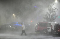 Signage at the entrance to the parking lot of Tropicana Field where the roof was torn off during Hurricane Milton on Thursday, Oct. 10, 2024, in St. Petersburg, Fla. (AP Photo/Mike Carlson)