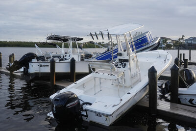 Small boats rests on a pier after they were unmoored during Hurricane Milton, Thursday, Oct. 10, 2024, in Fort Myers, Fla. (AP Photo/Marta Lavandier)