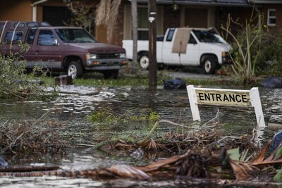 High water is seen on Hillsborough street in the aftermath of hurricane Milton, Thursday, Oct. 10, 2024, in Tampa, Fla. (AP Photo/Mike Stewart)