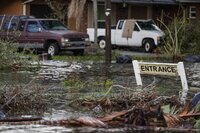 High water is seen on Hillsborough street in the aftermath of hurricane Milton, Thursday, Oct. 10, 2024, in Tampa, Fla. (AP Photo/Mike Stewart)