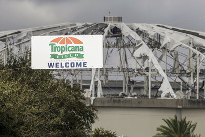 Signage at the entrance to the parking lot of Tropicana Field where the roof was torn off during Hurricane Milton on Thursday, Oct. 10, 2024, in St. Petersburg, Fla. (AP Photo/Mike Carlson)