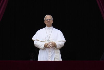 Pope Leo XIV delivers his blessing from the central balcony of St. Peter's Basilica for his first Sunday blessing after his election, in St. Peter's Square at the Vatican, Sunday, May 11, 2025.(AP Photo/Andrew Medichini)