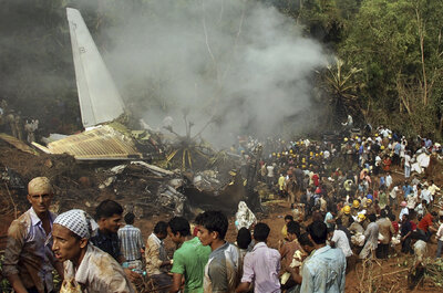FILE- Rescuers work at the site of an Air India plane that crashed in Mangalore, in the southern Indian state of Karnataka, Saturday, May 22, 2010. (AP Photo)