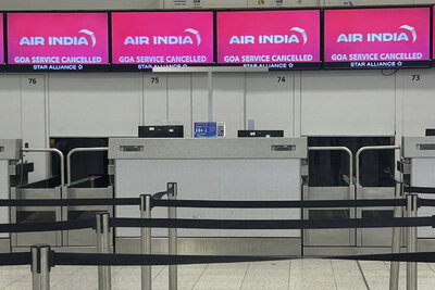 Air India desk at Gatwick Airport, showing information that the flight to Goa has been cancelled, Thursday, June 12, 2025, after an Air India jet bound for London crashed in Ahmedabad, India with more than 240 people on board. (AP Photo/Kin Cheung)