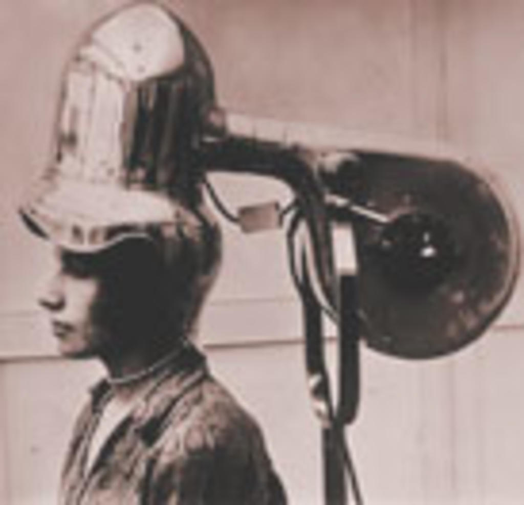 Imagen que muestra uno de los primeros secadores de cabello. (INTERNET)
