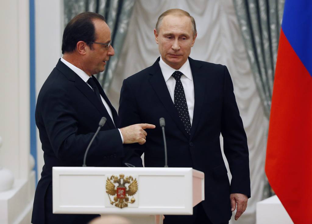 Acuerdo. El presidente ruso, Vladimir Putin (d), y su homólogo francés, Francois Hollande.