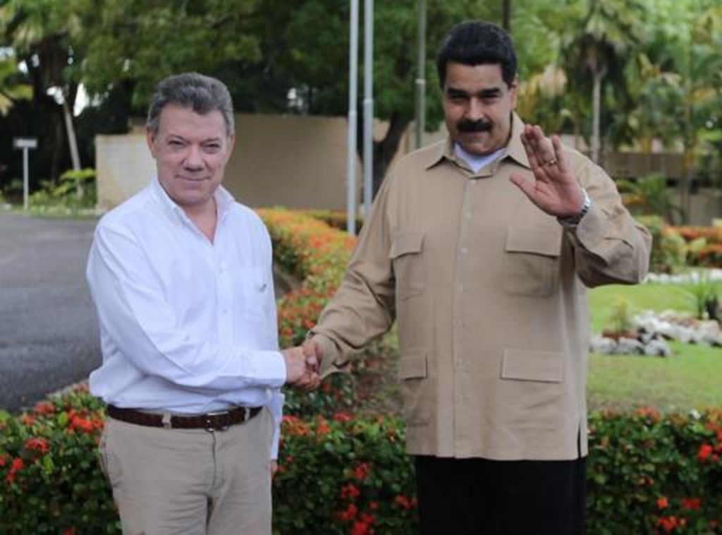 Tras un encuentro que se extendió por casi tres horas, el presidente venezolano Nicolás Maduro y Santos decidieron abrir de forma progresiva la frontera. (AP)