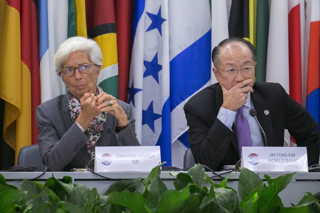 Deuda.  La directora gerente del FMI Christine Lagarde (i) y el presidente del BM Jim Yong Kim 