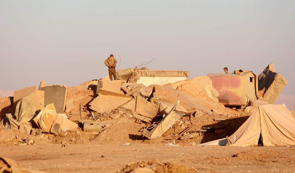 Destrucción. A lo largo de Mosul, las tropas iraquíes han encontrado varias fosas.