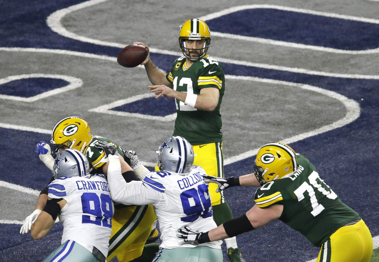 Aaron Rodgers lució en la victoria de ayer de los Packers sobre Cowboys. (AP)