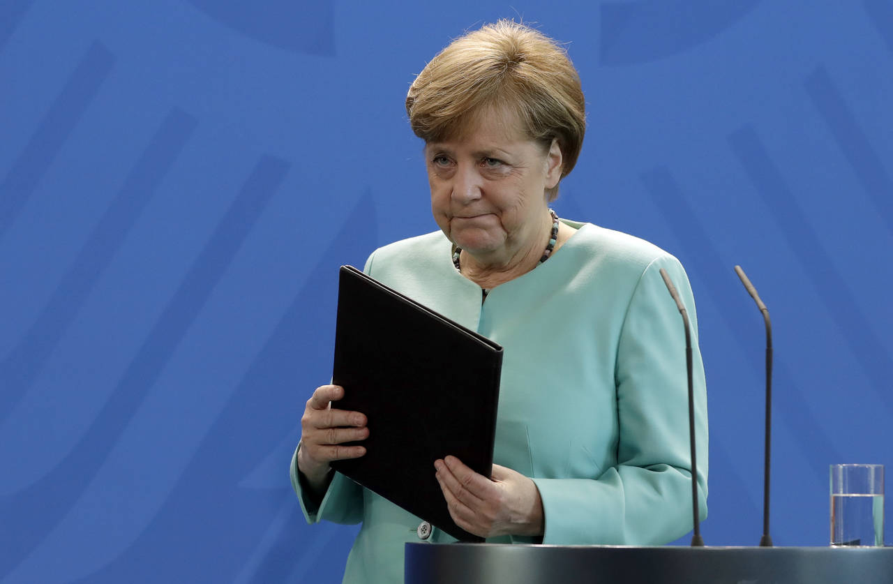 Liderazgo. Ángela Merkel, asumió ayer el liderazgo de la lucha global del cambio climático tras la retirada de Trump. (EFE)