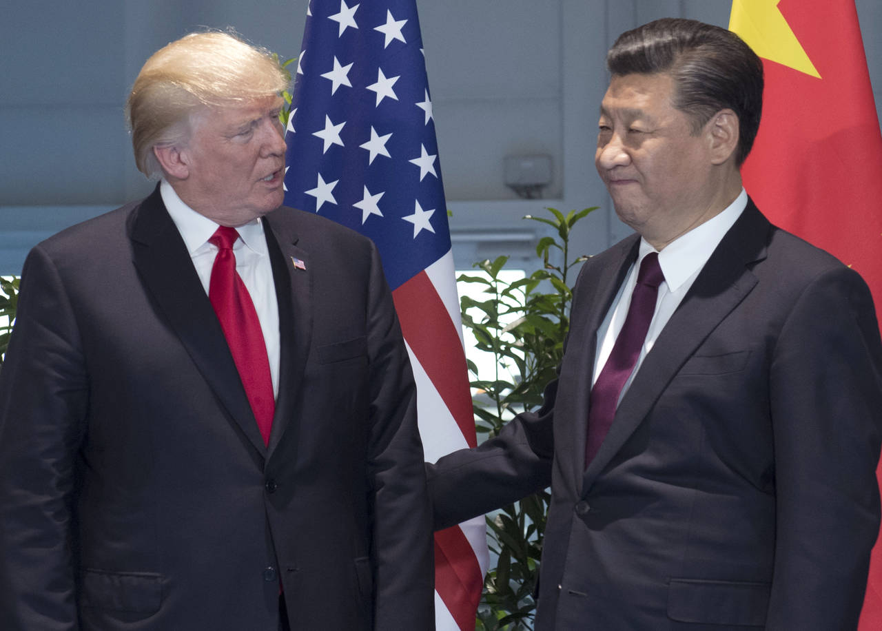 Aclara. Xi Jinping (der.) advirtió a Donald Trump que 'ciertos factores negativos' perjudicaban la relación bilateral.