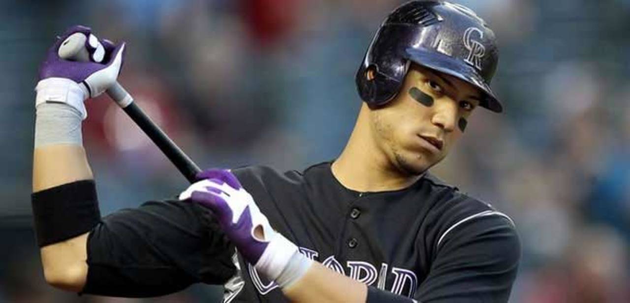 Será la décima temporada que dispute Carlos González con los Rockies de Colorado, el año pasado bateó para .262. (Archivo)