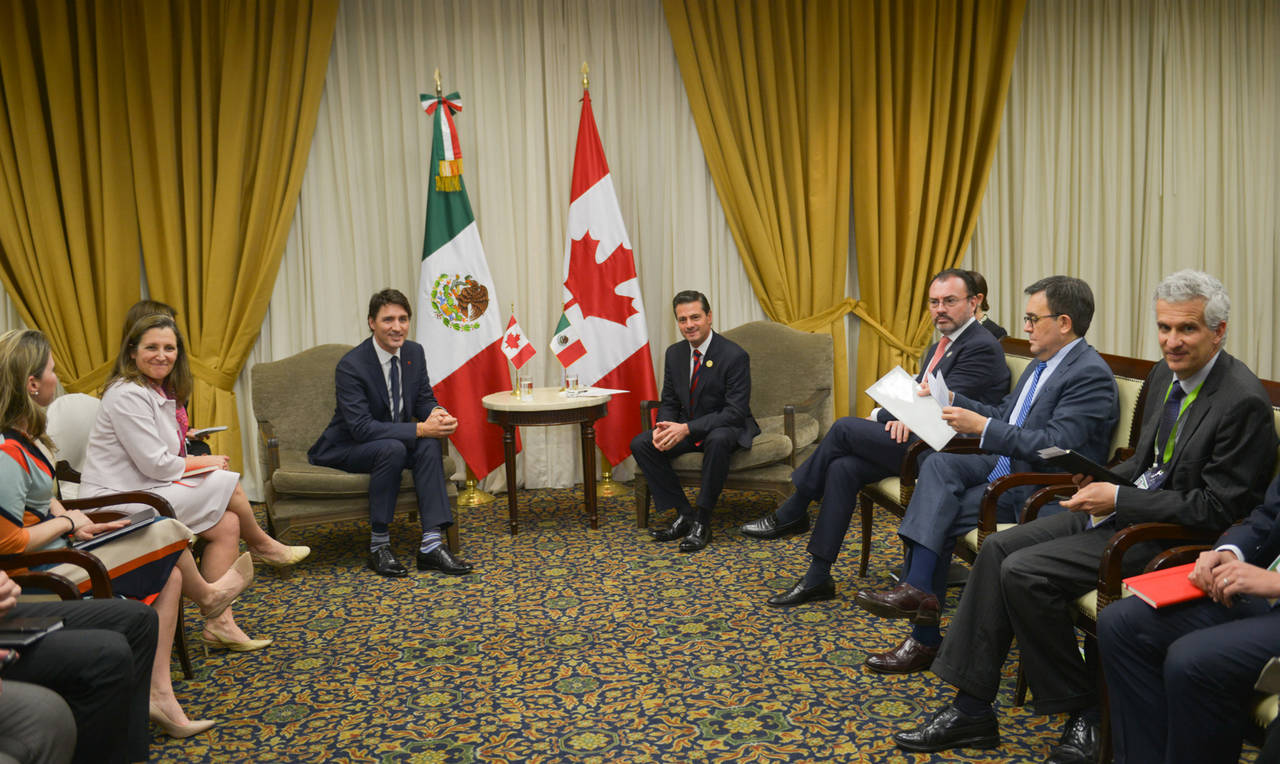 Comercio. En la imagen los presidentes Peña Nieto y Justin Trudeau dialogando.