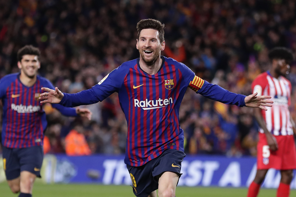 El argentino Lionel Messi, del Barcelona, festeja tras anotar el segundo tanto ante el Atlético de Madrid.