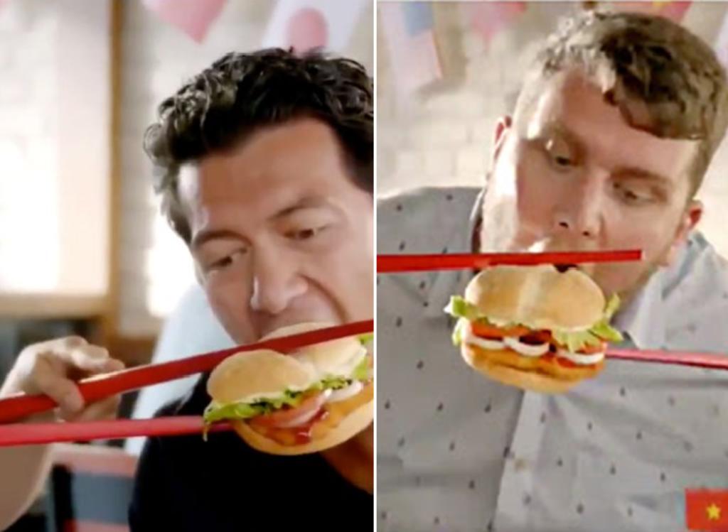 Gente intentando comer un sándwich usando palillos, muestra el comercial. (INTERNET)