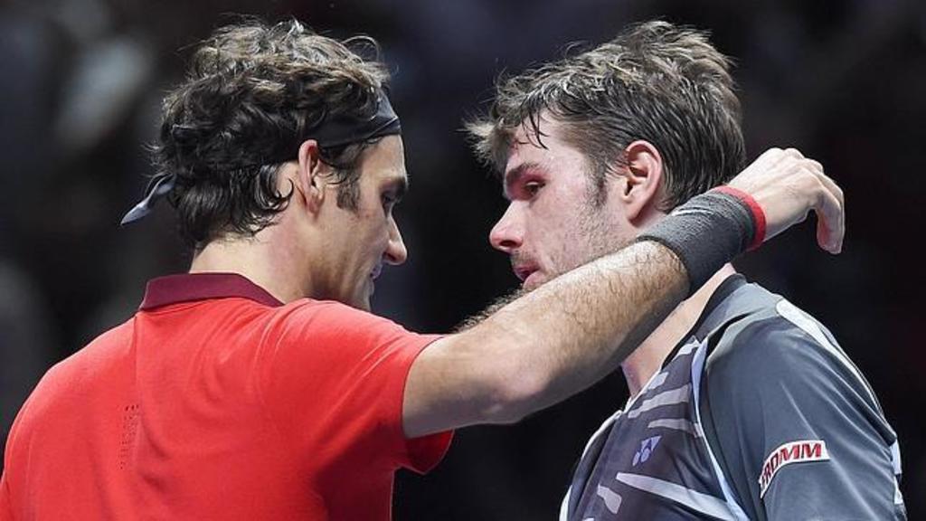 Los suizos Roger Federer (i) y Stanislas Wawrinka se medirán hoy por 26ta ocasión. (ARCHIVO)