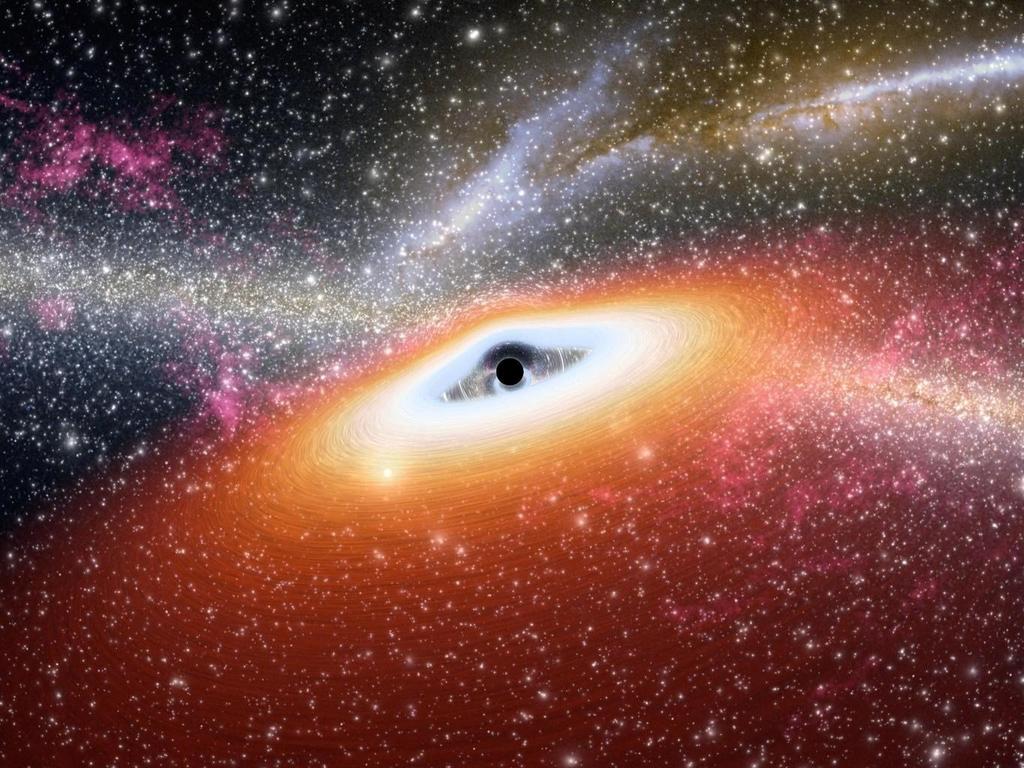 Hace 12,500 millones de años, mientras se formaban las primeras galaxias del universo, los reservorios de gas frío que las envolvían sirvieron de alimento a los agujeros negros. (ARCHIVO) 