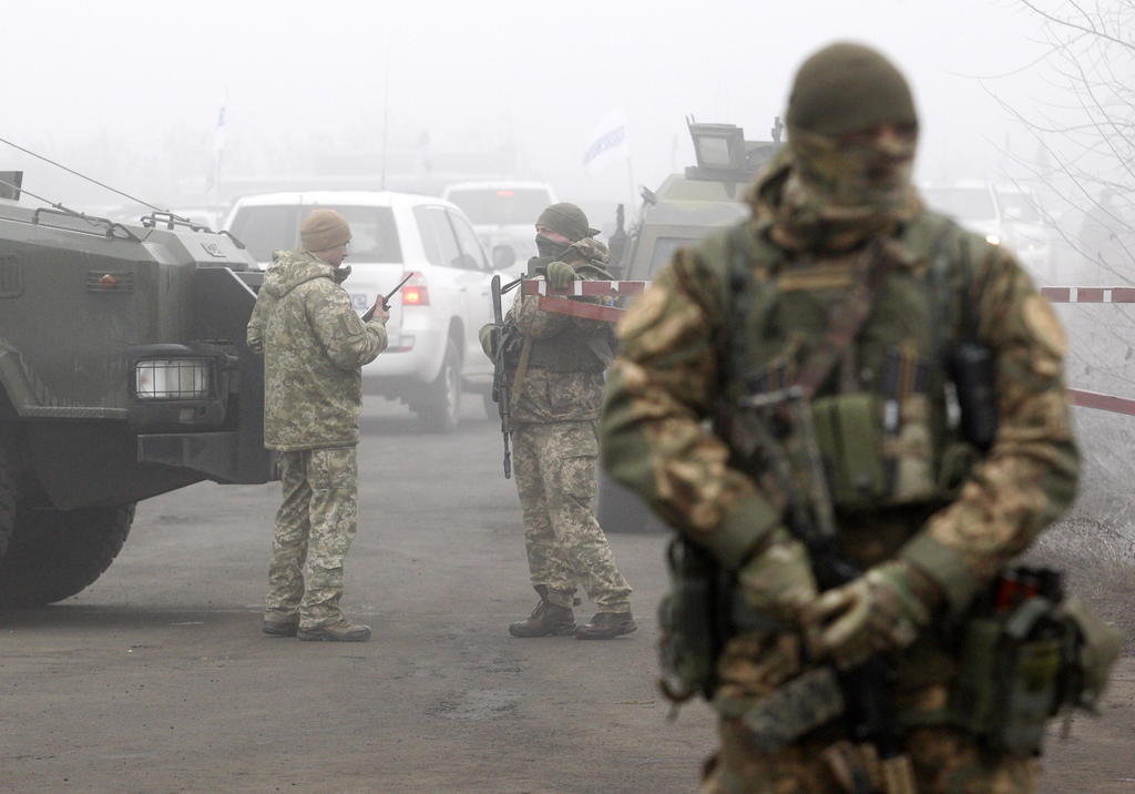 El canje tiene lugar en el puesto de control de Mayorsk, que conecta la zona de Donetsk controlada por los separatistas con el territorio bajo control del Ejército ucraniano. (EFE)