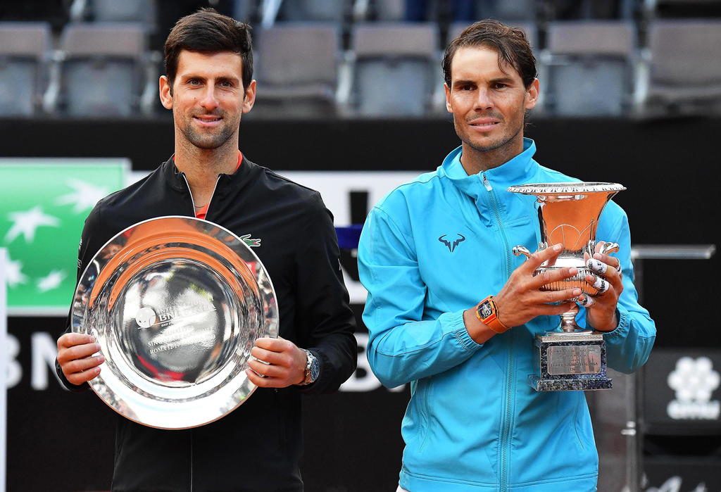 Novak Djokovic (i) y Rafael Nadal (d) ganaron los cuatro títulos de Grand Slam en 2019, el serbio se coronó en el Abierto de Australia y Wimbledon; el español triunfo en Roland Garros y en el Abierto de Estados Unidos (ARCHIVO)