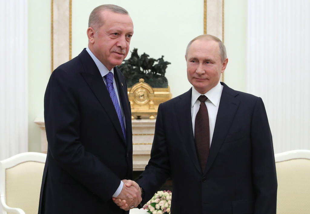 'Esta misma medianoche estableceremos un alto el fuego', dijo Erdogan en una rueda de prensa conjunta con su homólogo ruso, Vladímir Putin. (EFE)