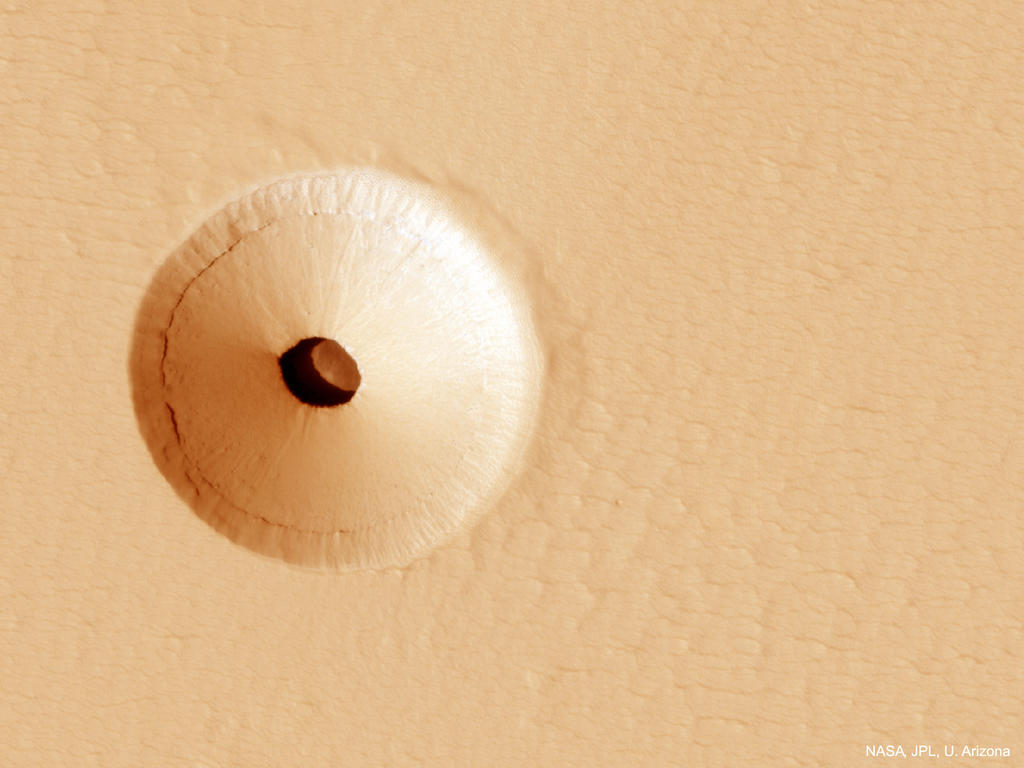'Agujeros como este son de particular interés porque sus cuevas interiores están relativamente protegidas de la dura superficie de Marte, lo que los hace relativamente buenos candidatos para contener la vida marciana', sostuvo la NASA en la publicación. (NASA)
