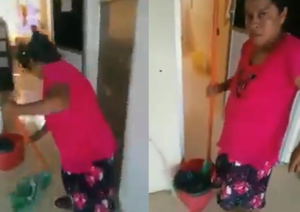 En el video que se hizo viral en redes sociales, la empleada de limpieza aparece trapeando el suelo mientras es humillada por la funcionaria (CAPTURA) 