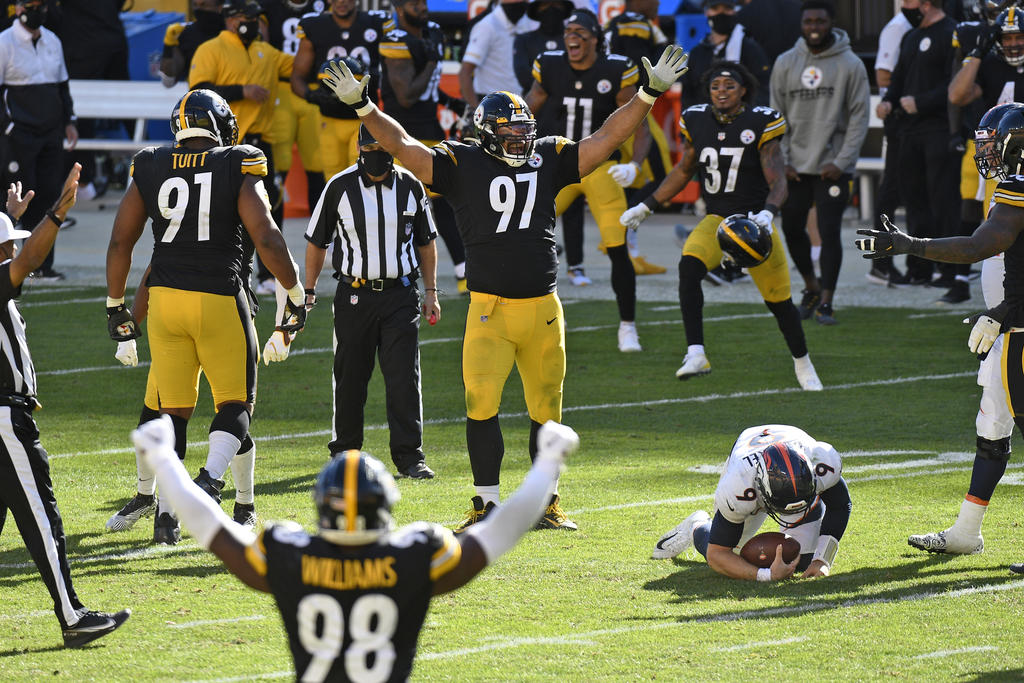 Ben Roethlisberger pasó para 311 yardas y dos touchdowns con una intercepción y los Steelers de Pittsburgh contuvieron el embate de Denver en un triunfo el domingo 26-21 sobre los Broncos. (ARCHIVO)