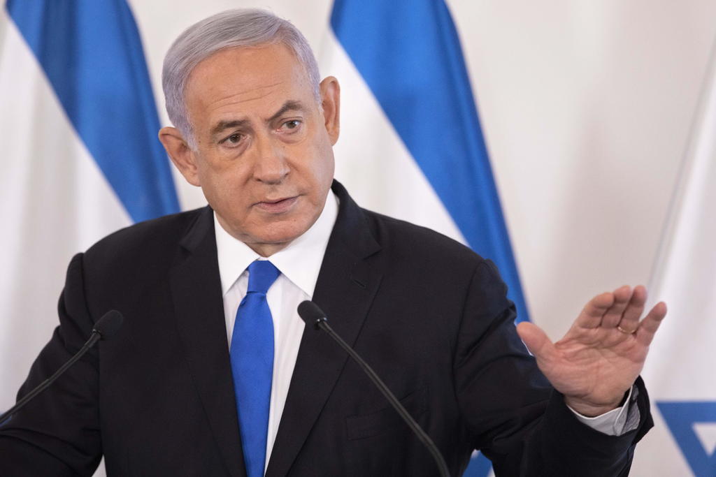 El primer ministro israelí, Benjamín Netanyahu, aseguró hoy que está 'decidido' a seguir con la operación militar en Gaza, poco después de hablar con el presidente de EUA, Joe Biden, que le urgió a llevar a cabo 'una desescalada significativa' hoy mismo. (EFE) 
