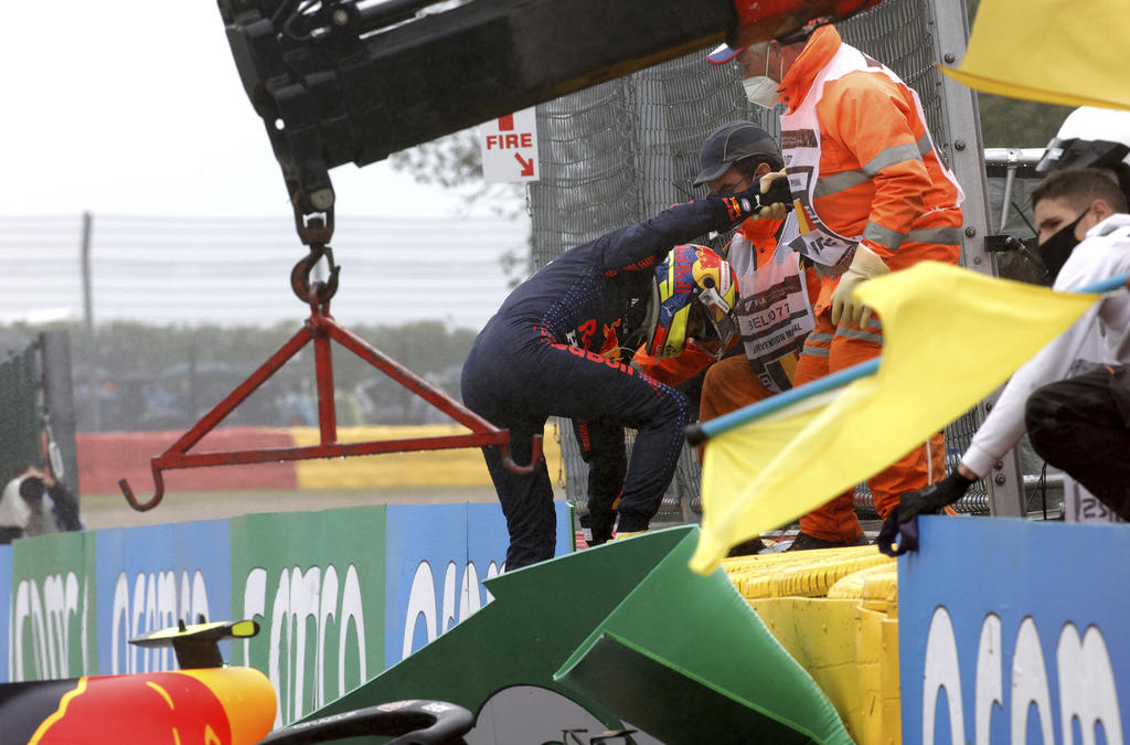 El mexicano Sergio Pérez (Red Bull) no podrá tomar parte este domingo en el Gran Premio de Bélgica, el duodécimo del Mundial de Fórmula Uno. (AP)