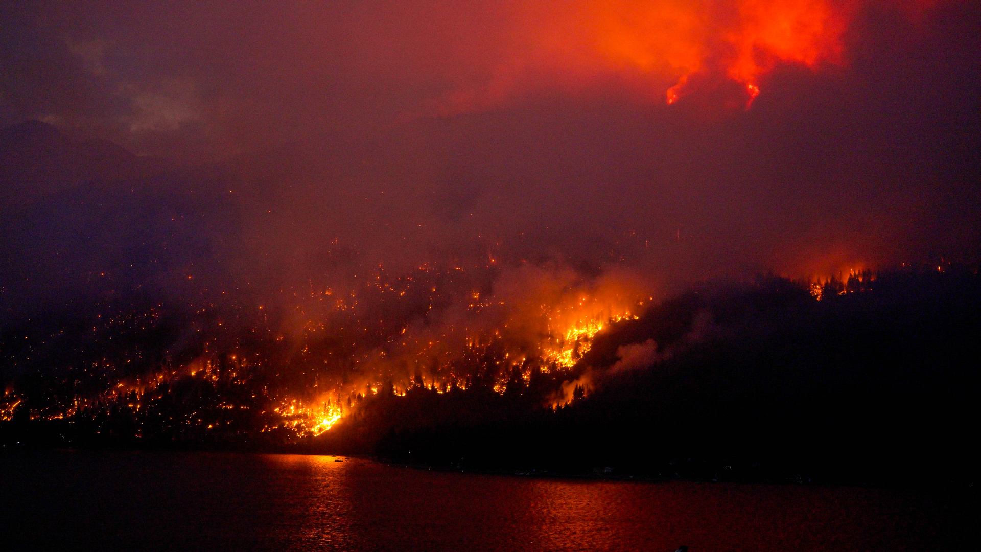 Fires force 35,000 people to flee their homes in western Canada